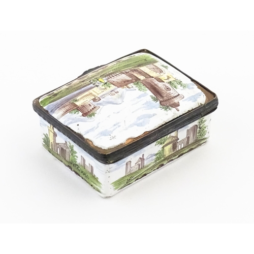 1129 - A late 19th / early 20thC enamel snuff box of rectangular form decorated with a landscape scene with... 