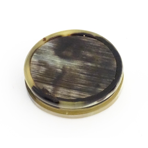 1130 - A 19thC horn snuff box of oval form. Approx. 1 3/4