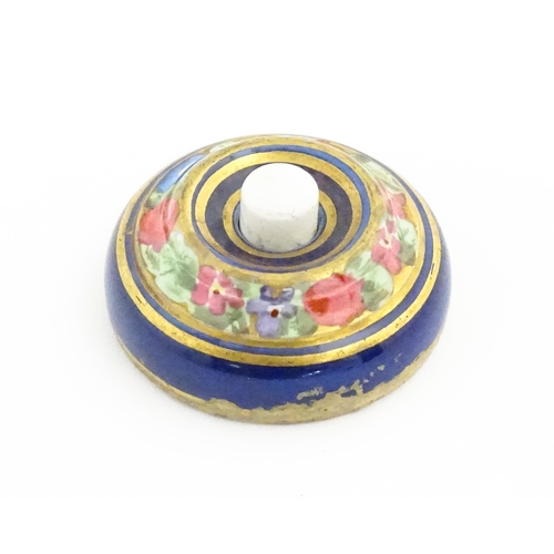 1137 - An early 20thC porcelain door bell / push bell with  banded floral and foliate decoration. Approx. 2... 