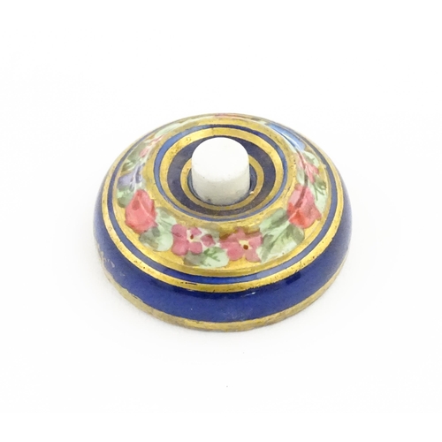 1137 - An early 20thC porcelain door bell / push bell with  banded floral and foliate decoration. Approx. 2... 