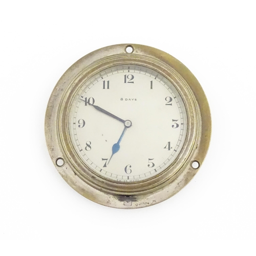 1140 - A mid 20thC vehicle dashboard clock, with chromed finish, the dial with blued hands and marked 8 Day... 