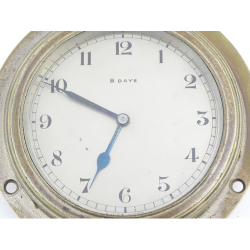 1140 - A mid 20thC vehicle dashboard clock, with chromed finish, the dial with blued hands and marked 8 Day... 