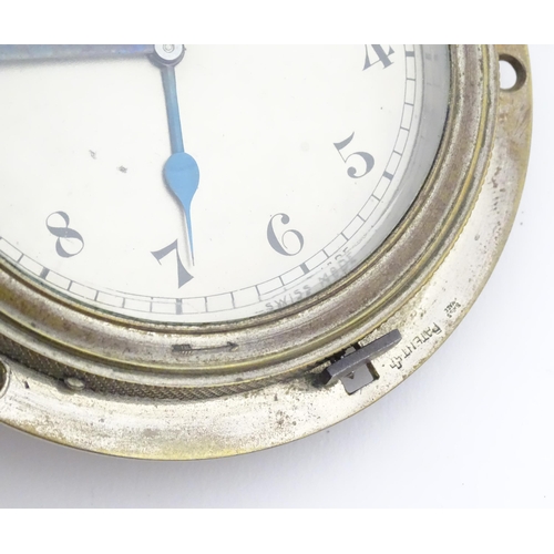 1140 - A mid 20thC vehicle dashboard clock, with chromed finish, the dial with blued hands and marked 8 Day... 