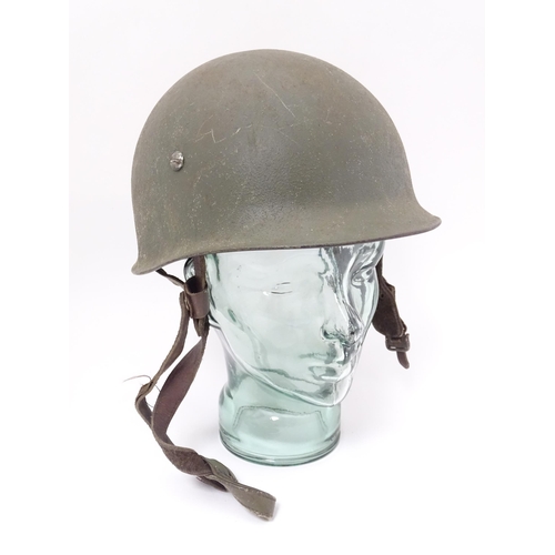 794 - Militaria : a post-WWII Belgian M1951 / M51 helmet, in army green finish with Belgian flag to one si... 