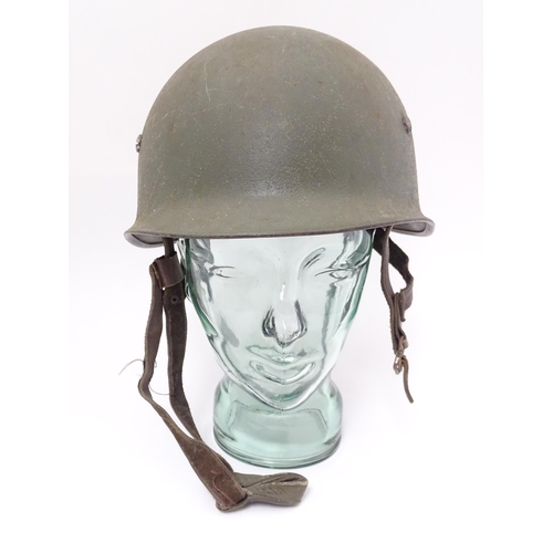 794 - Militaria : a post-WWII Belgian M1951 / M51 helmet, in army green finish with Belgian flag to one si... 