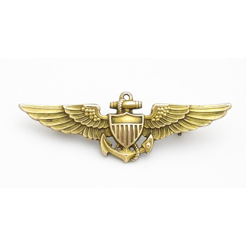 808 - Militaria : a mid 20thC silver gilt United States Navy naval aviator cap badge, the reverse marked A... 