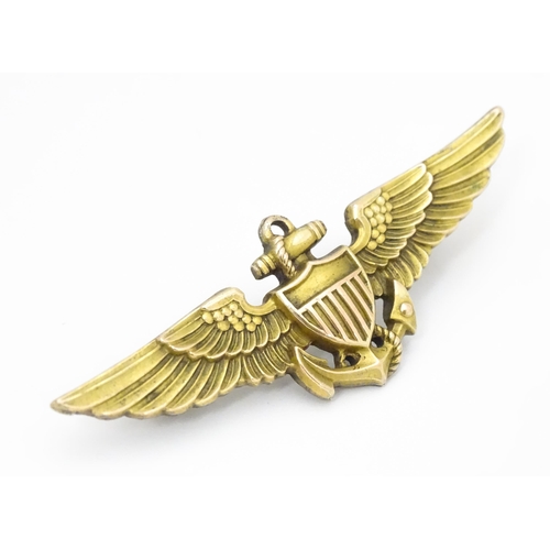 808 - Militaria : a mid 20thC silver gilt United States Navy naval aviator cap badge, the reverse marked A... 