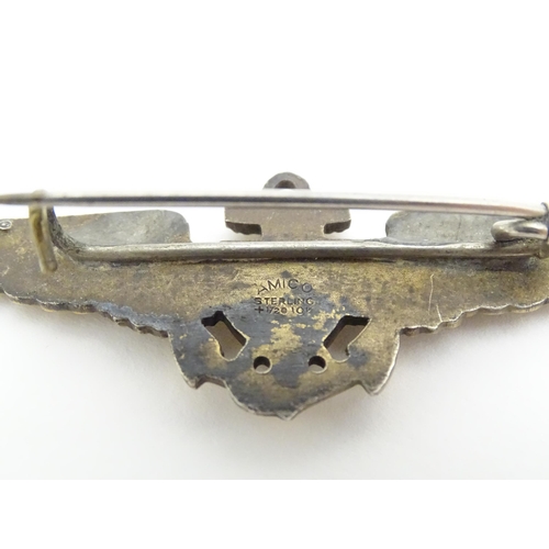 808 - Militaria : a mid 20thC silver gilt United States Navy naval aviator cap badge, the reverse marked A... 