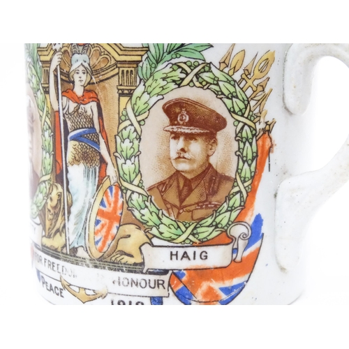 809 - Militaria: an early 20thC ceramic mug with First World War / WWI / World War 1 commemorative decorat... 