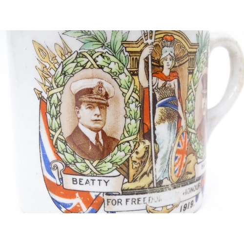 809 - Militaria: an early 20thC ceramic mug with First World War / WWI / World War 1 commemorative decorat... 