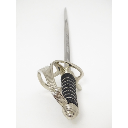 813 - Militaria : a cased Pooley Sword novelty letter opener formed as a British Army ceremonial sword, co... 