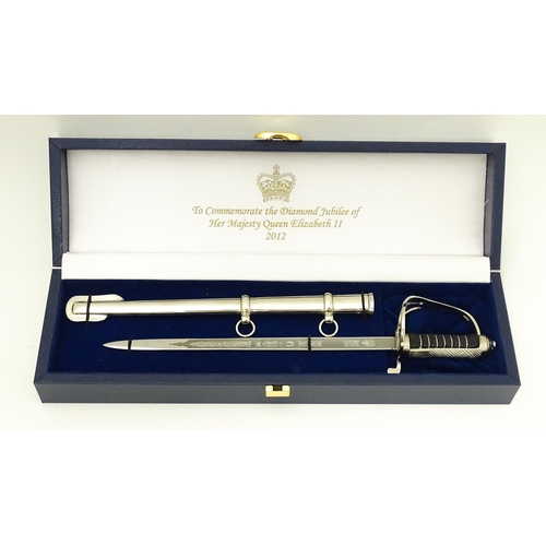 813 - Militaria : a cased Pooley Sword novelty letter opener formed as a British Army ceremonial sword, co... 