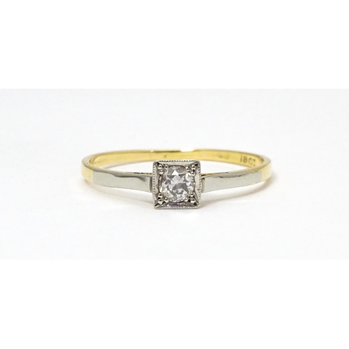 626 - An 18ct gold ring with platinum set diamond solitaire. Ring size approx. Q