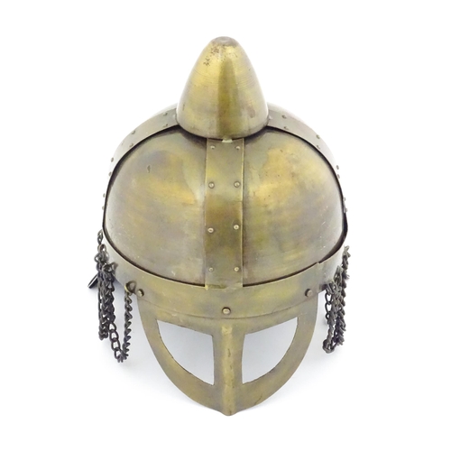 817 - A 21stC Viking style helmet, of brass construction with leather liner, measuring approx 12 1/2