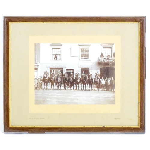 818 - Militaria : a Victorian monochrome photograph depicting nine mounted Royal Horse Artillery gunners o... 