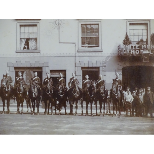 818 - Militaria : a Victorian monochrome photograph depicting nine mounted Royal Horse Artillery gunners o... 