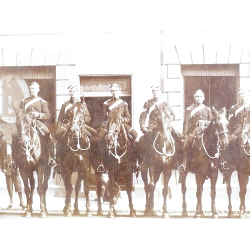 818 - Militaria : a Victorian monochrome photograph depicting nine mounted Royal Horse Artillery gunners o... 