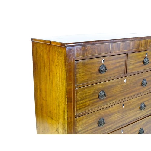 1325 - A Victorian mahogany chest of drawers of large proportions, the chest comprising, two small frieze d... 