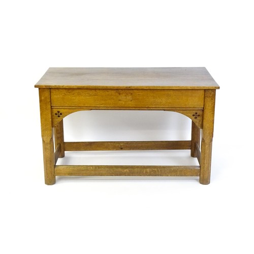 1329 - A late 19thC / early 20thC oak Gothic console table, the rectangular top above pierced quatrefoil de... 