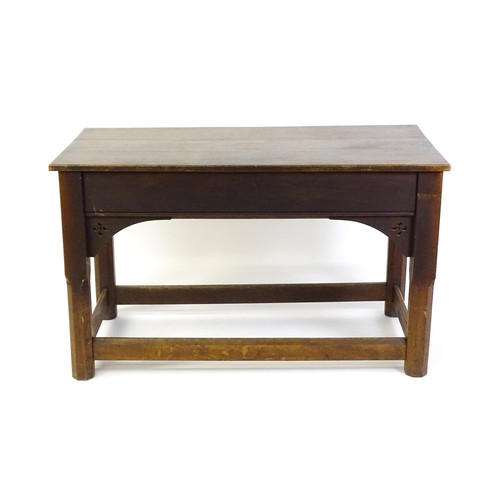 1329 - A late 19thC / early 20thC oak Gothic console table, the rectangular top above pierced quatrefoil de... 