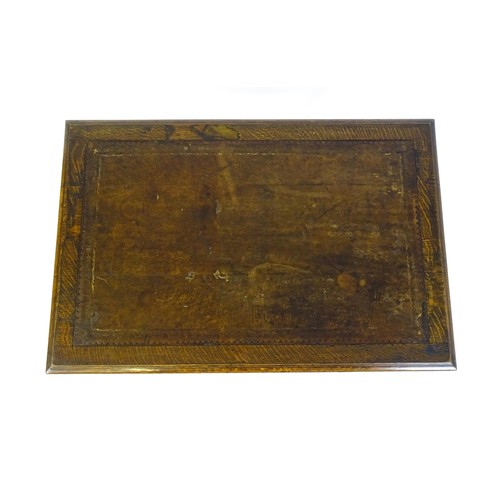 1333 - A Victorian oak desk with a moulded top and inset leather writing surface, having a frieze drawer ab... 