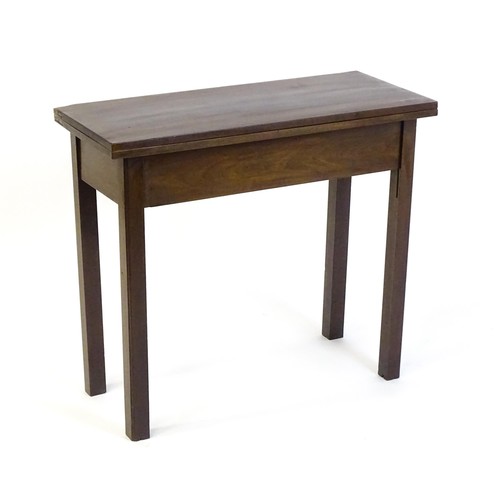 1371 - A Georgian mahogany tea table with a hinged top above four chamfered legs. 32