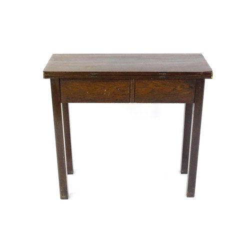 1371 - A Georgian mahogany tea table with a hinged top above four chamfered legs. 32