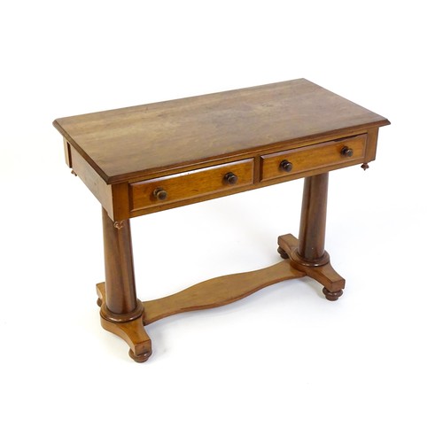 1334 - A Victorian mahogany desk / table with a rectangular moulded top above two short drawers with knob h... 