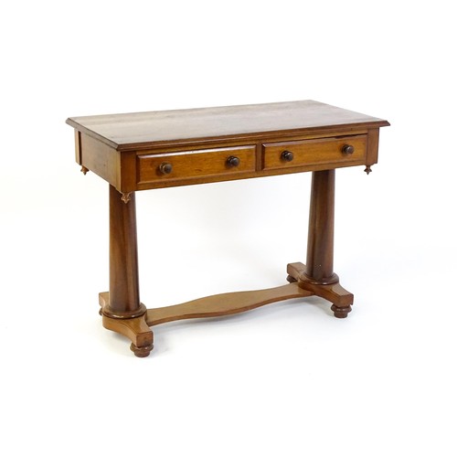 1334 - A Victorian mahogany desk / table with a rectangular moulded top above two short drawers with knob h... 