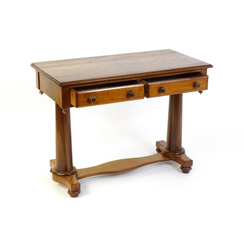 1334 - A Victorian mahogany desk / table with a rectangular moulded top above two short drawers with knob h... 