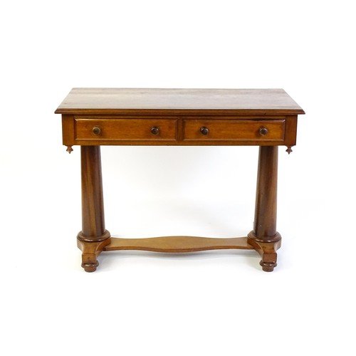 1334 - A Victorian mahogany desk / table with a rectangular moulded top above two short drawers with knob h... 