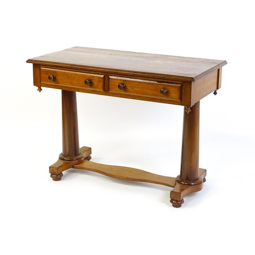 1334 - A Victorian mahogany desk / table with a rectangular moulded top above two short drawers with knob h... 