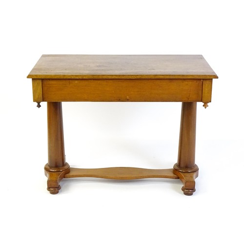 1334 - A Victorian mahogany desk / table with a rectangular moulded top above two short drawers with knob h... 