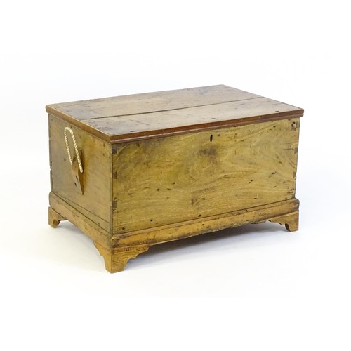 1370 - A late Georgian fruitwood trunk with exposed dovetail construction and rope handles to either side, ... 