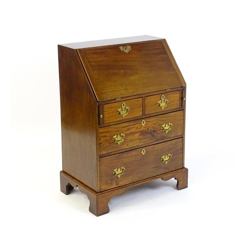 1327 - A Victorian mahogany bureau with a fall front above two short over two long graduated drawers with b... 