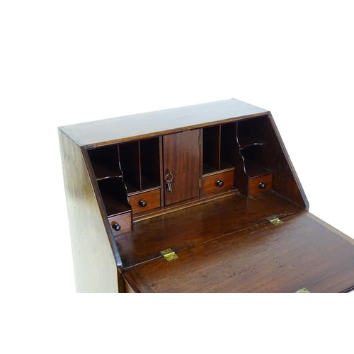 1327 - A Victorian mahogany bureau with a fall front above two short over two long graduated drawers with b... 