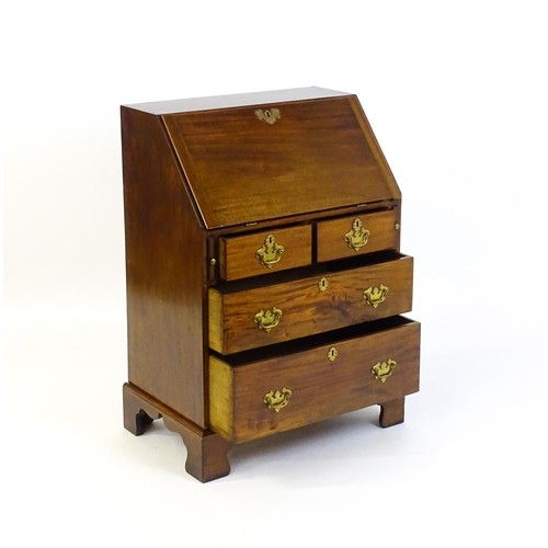 1327 - A Victorian mahogany bureau with a fall front above two short over two long graduated drawers with b... 