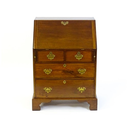 1327 - A Victorian mahogany bureau with a fall front above two short over two long graduated drawers with b... 