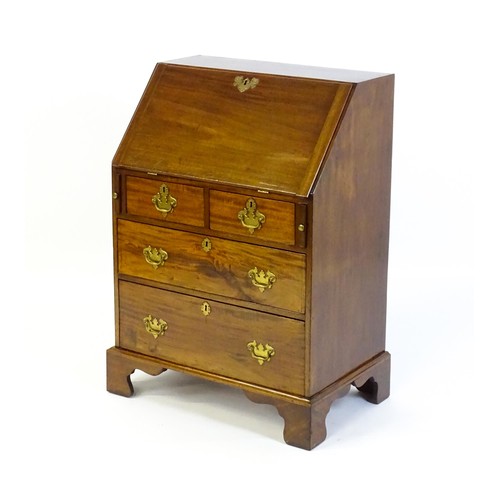 1327 - A Victorian mahogany bureau with a fall front above two short over two long graduated drawers with b... 