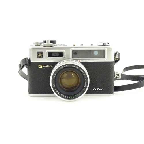 1141 - Two 20thC film cameras to include a Yashica Electro 35 camera, and a Bencini Koroll 24 S. Together w... 