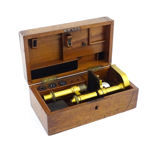 1146 - An early 20thC Leitz microscope, constructed from brass with a cast iron base, the mount stamped 'E.... 