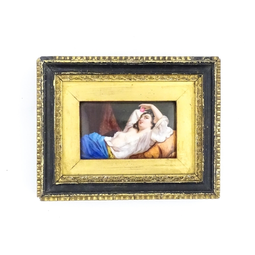 1159 - A 20thC hand painted porcelain plaque depicting a reclining lady with fruit after Hugo Birger. Appro... 