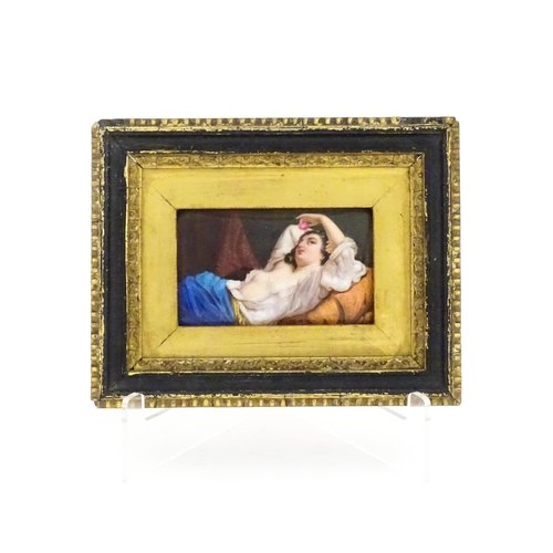 1159 - A 20thC hand painted porcelain plaque depicting a reclining lady with fruit after Hugo Birger. Appro... 