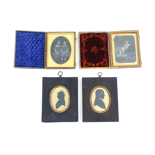 1162 - Two Victorian daguerreotype photographs in folding cases depicting portraits of children, etc. Toget... 