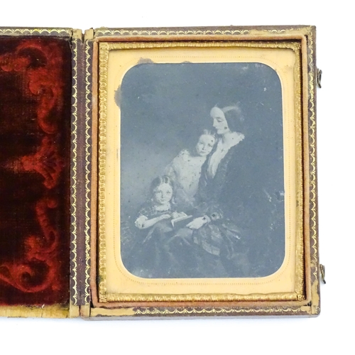 1162 - Two Victorian daguerreotype photographs in folding cases depicting portraits of children, etc. Toget... 