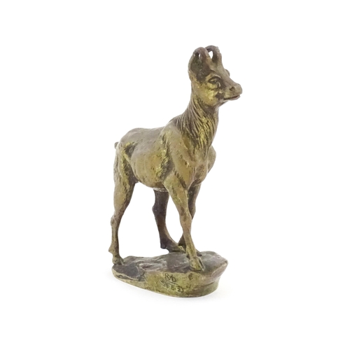 1166 - A 20thC car mascot modelled as a chamois after Charles Paillet, the circular base with facsimile sig... 