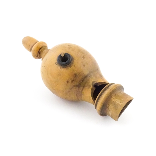 1167 - A Victorian treen boxwood whistle with acorn finial. Approx. 5