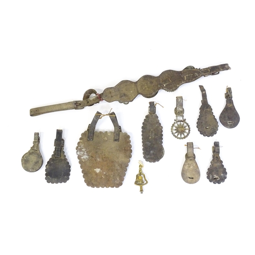 1055 - A quantity of Victorian and later horse brasses mounted to leather backing, variously decorated with... 