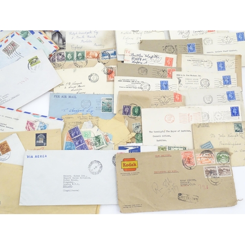 1195 - A large quantity of 19thC and later postage stamps and albums, to include two Penny Black stamps, on... 