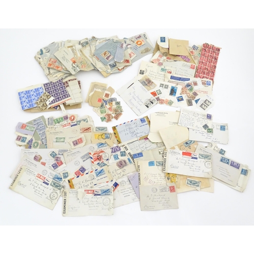 1195 - A large quantity of 19thC and later postage stamps and albums, to include two Penny Black stamps, on... 